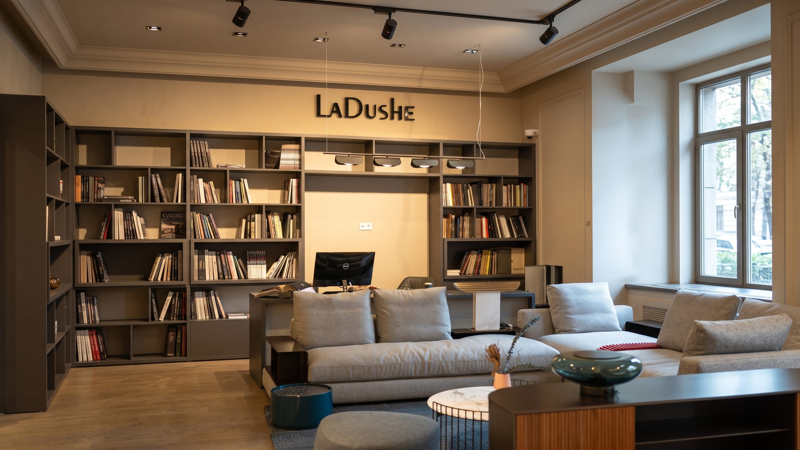 Interior of the La Dushe design space with a work area for architects